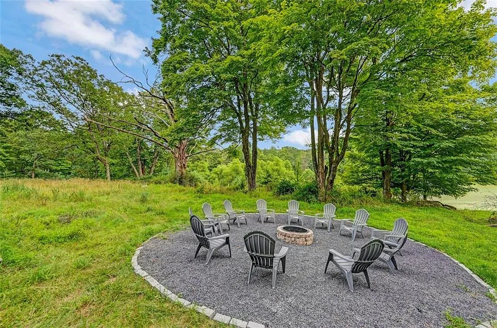 Poconos Palace in East Stroudsburg Pennsylvania, exterior view of pebbled fire pit and outdoor seating