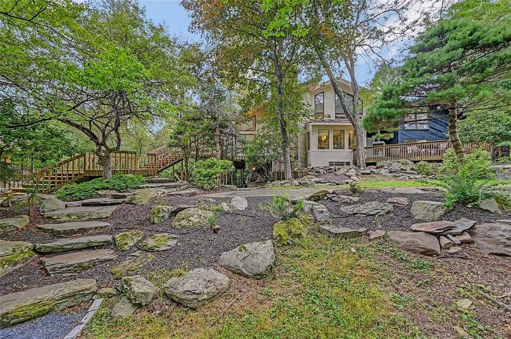 Poconos Palace in East Stroudsburg Pennsylvania, exterior seating area with large rocks and stone gravel