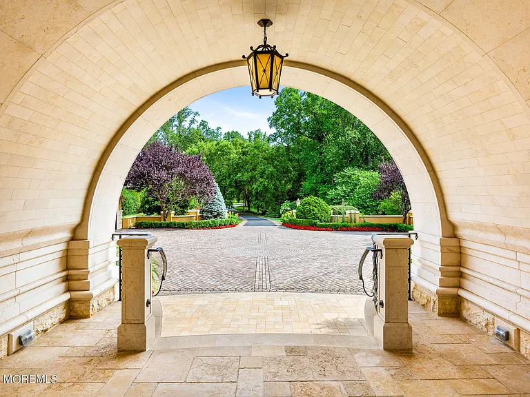 Massive Tuscan Palace in New Jersey on the Rumson and Navasink Rivers, exterior courtyard with arched doorways