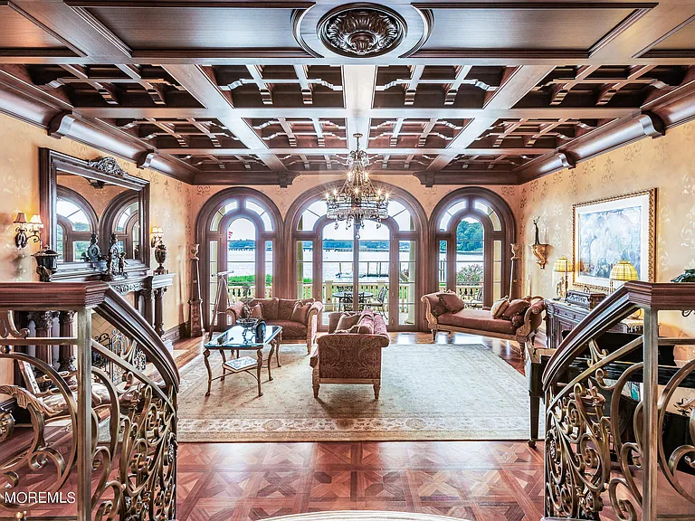 Massive Tuscan Palace in New Jersey on the Rumson and Navasink Rivers, interior living room with wood carved tray ceilings and water views