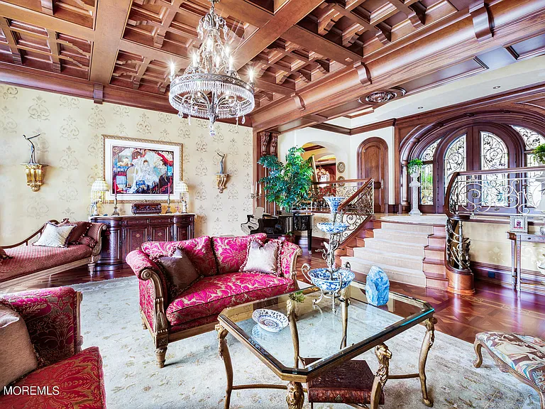 Massive Tuscan Palace in New Jersey on the Rumson and Navasink Rivers, interior living room with wood carved tray ceilings and water views