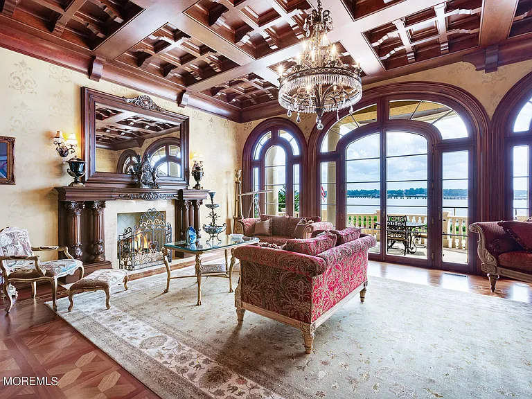 Massive Tuscan Palace in New Jersey on the Rumson and Navasink Rivers, interior living room with wood carved tray ceilings and water views