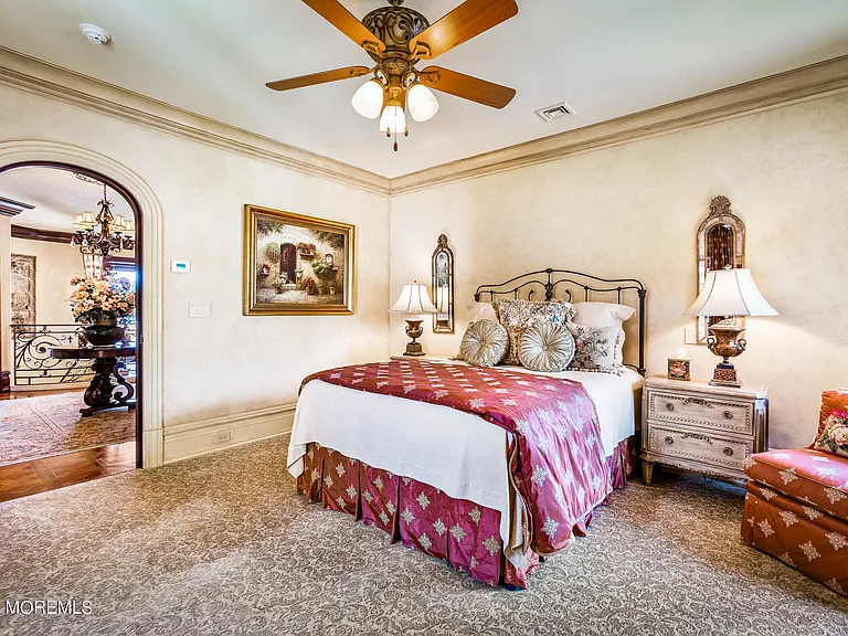 Massive Tuscan Palace in New Jersey on the Rumson and Navasink Rivers, oversized bedroom with large wooden bed