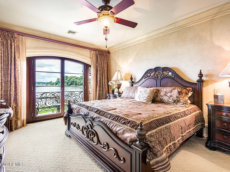 Massive Tuscan Palace in New Jersey on the Rumson and Navasink Rivers, oversized bedroom with large wooden bed