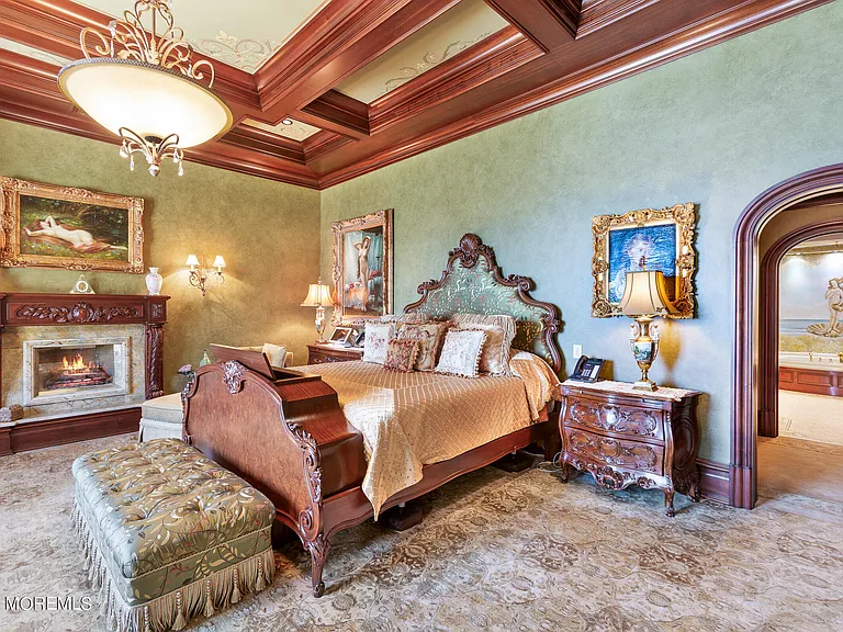 Massive Tuscan Palace in New Jersey on the Rumson and Navasink Rivers, oversized bedroom with large wooden bed