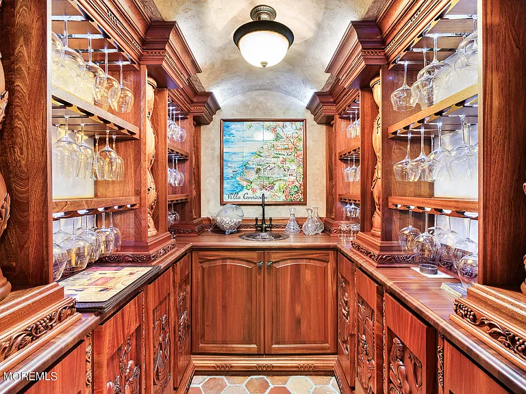 Massive Tuscan Palace in New Jersey on the Rumson and Navasink Rivers, enormous wood wine cellar and liquor storage cabinet