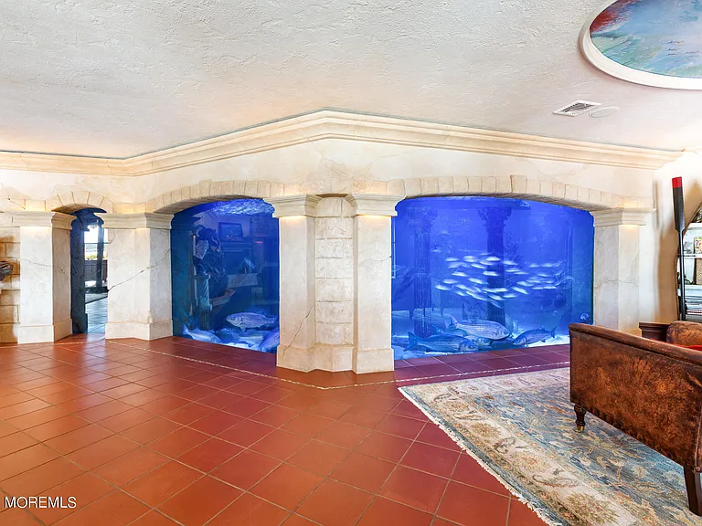 Massive Tuscan Palace in New Jersey on the Rumson and Navasink Rivers, massive home fish tank wall