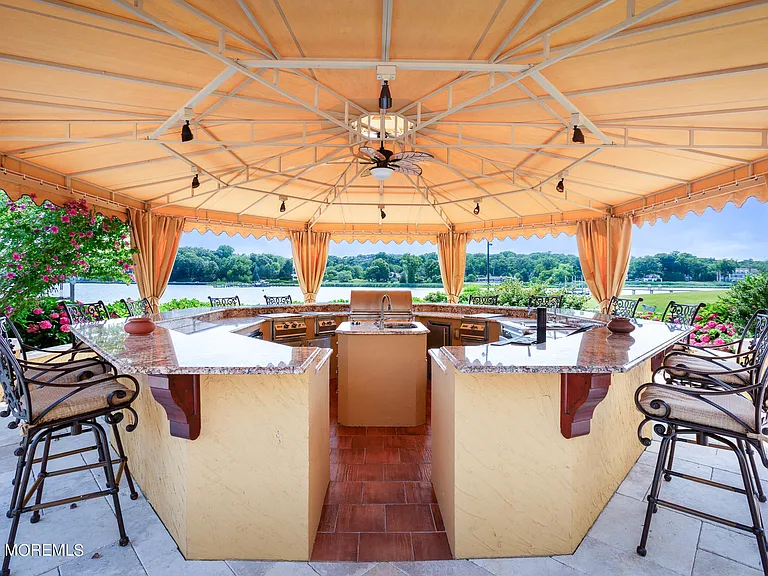 Massive Tuscan Palace in New Jersey on the Rumson and Navasink Rivers, exterior bar and outdoor kitchen