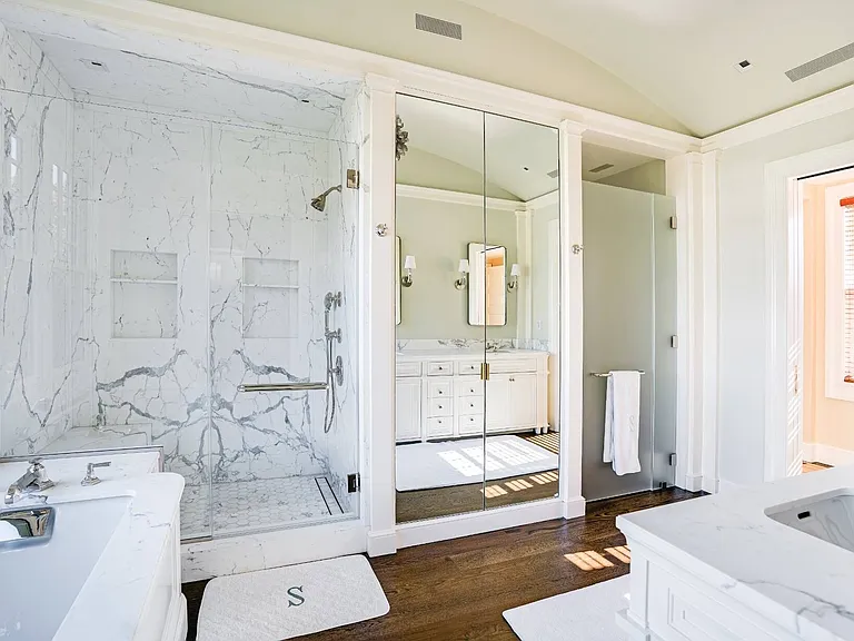 Old money Hamptons estate 134 Herrick Rd in Southampton New York, master bathroom with Italian marble