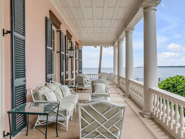 Scott Bessent's Charleston Waterfront Mansion, 1800s balcony with Atlantic views and black window shutters