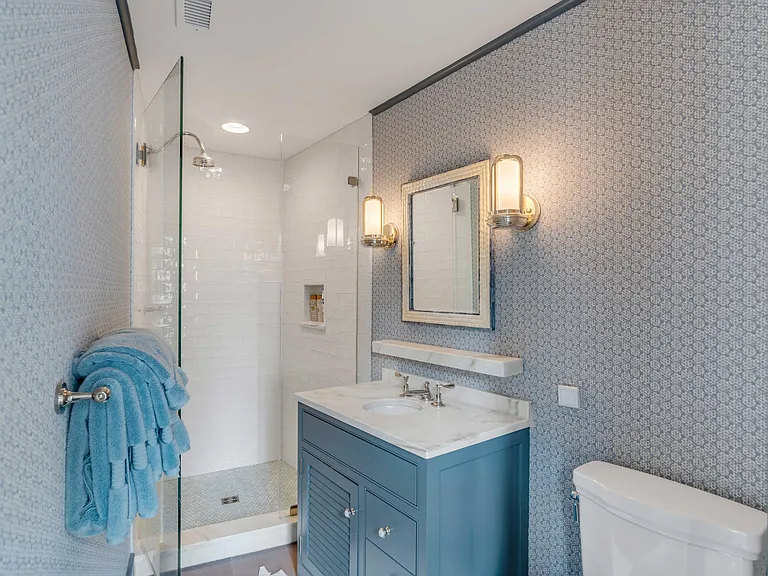 Scott Bessent's Charleston Waterfront Mansion, guest suite bathroom with blue and white vanity