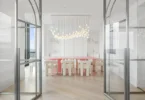 Boston's Most Expensive Penthouse Apartment, large dining room with double glass doors and massive pink dining table