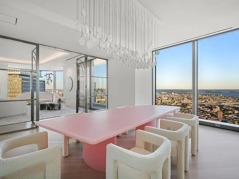 Boston's Most Expensive Penthouse Apartment, large dining room with double glass doors and massive pink dining table