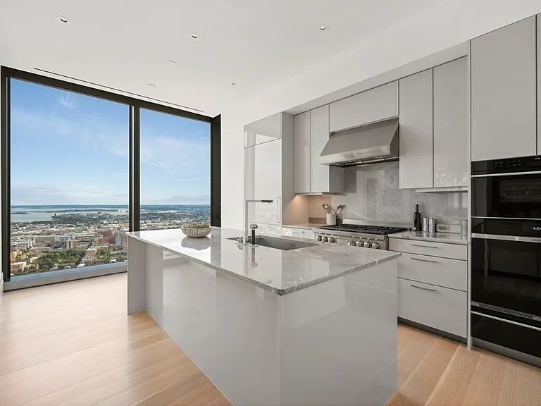 Boston's Most Expensive Penthouse Apartment, soft gray and white staff and catering kitchen