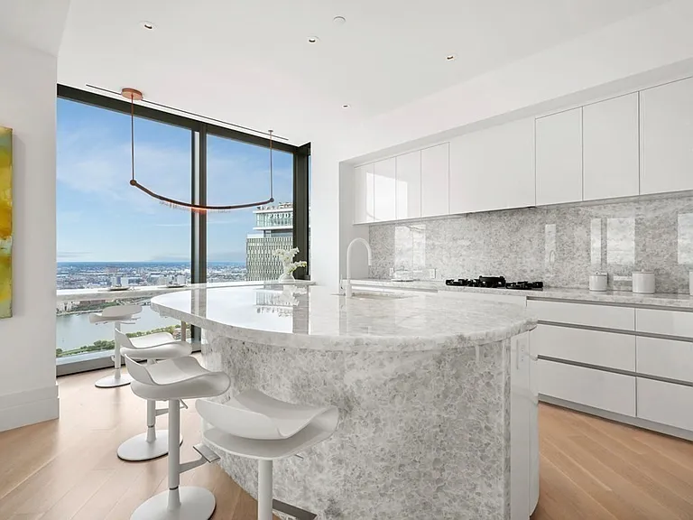 Boston's Most Expensive Penthouse Apartment, onyx kitchen in white and soft gray tones