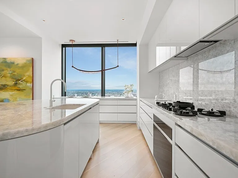 Boston's Most Expensive Penthouse Apartment, onyx kitchen in white and soft gray tones