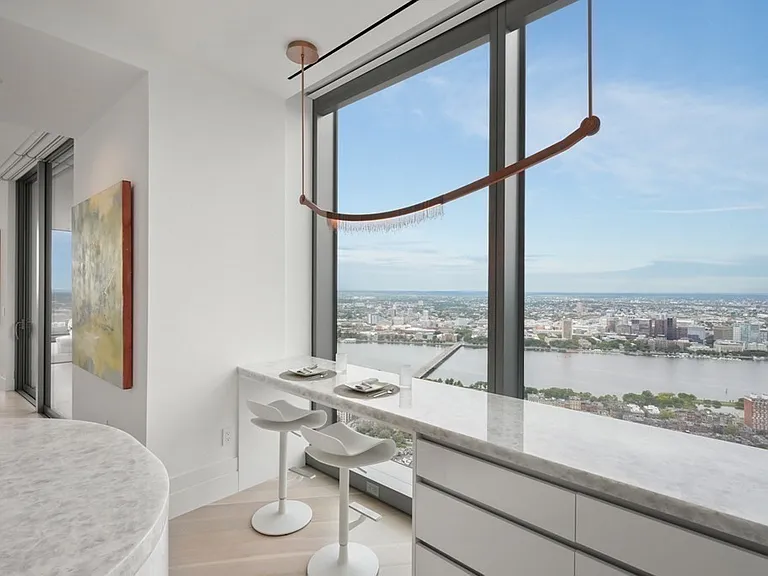 Boston's Most Expensive Penthouse Apartment, onyx kitchen in white and soft gray tones