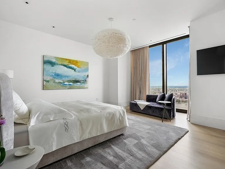 Boston's Most Expensive Penthouse Apartment, soft gray and white master bedroom with modern furniture