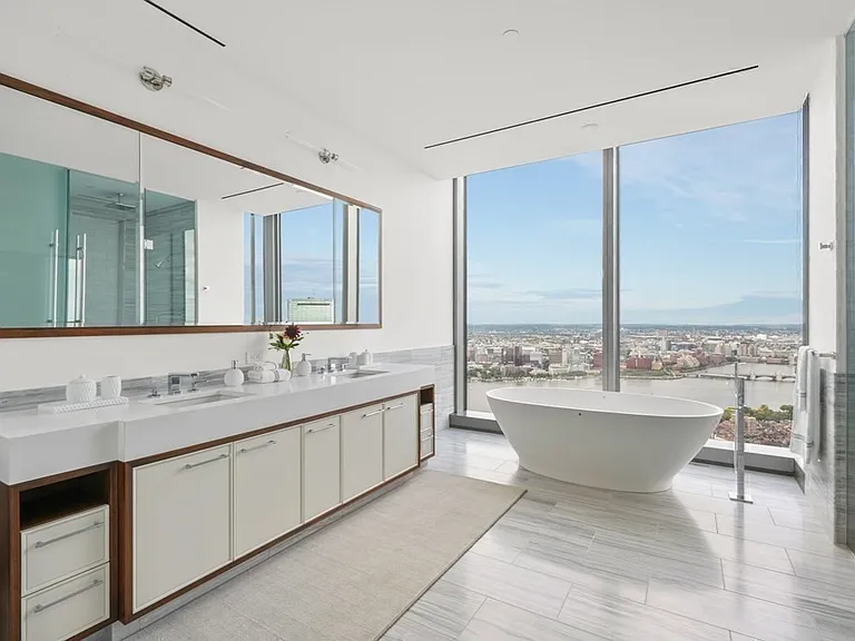 Boston's Most Expensive Penthouse Apartment, soft gray and white master bathroom with floor to ceiling windows