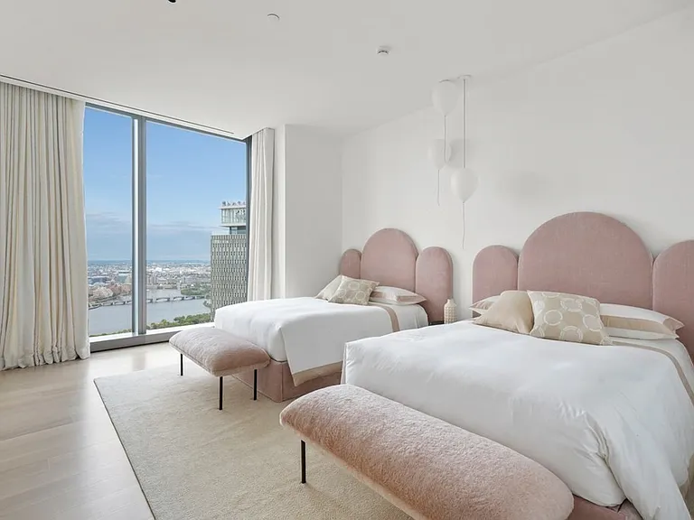 Boston's Most Expensive Penthouse Apartment, soft pink and white master bedroom with modern furniture