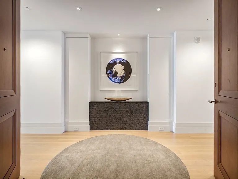 Boston's Most Expensive Penthouse Apartment, soft gray and white foyer with modern art collection