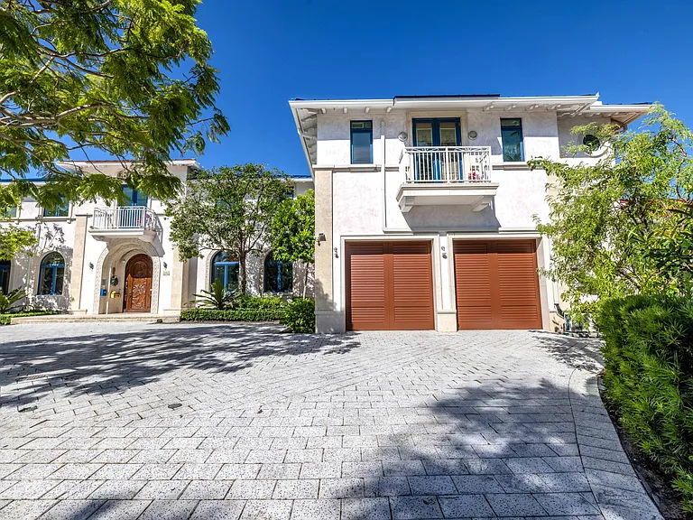 Crazy Florida mansion located at 1201 Marble Way in Boca Raton, exterior view of driveway and garage