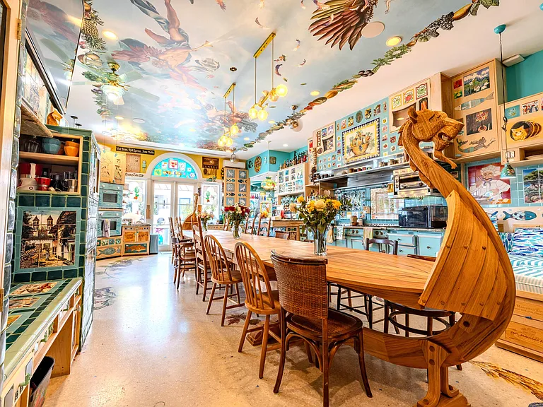 Crazy Florida mansion located at 1201 Marble Way in Boca Raton, la cornue kitchen with massive hand-carved viking boat dining table