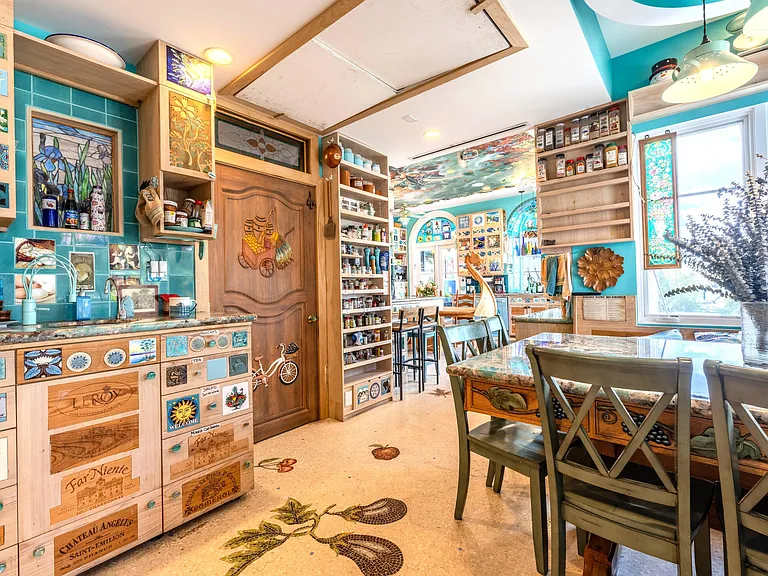 Crazy Florida mansion located at 1201 Marble Way in Boca Raton, la cornue kitchen with eclectic decor