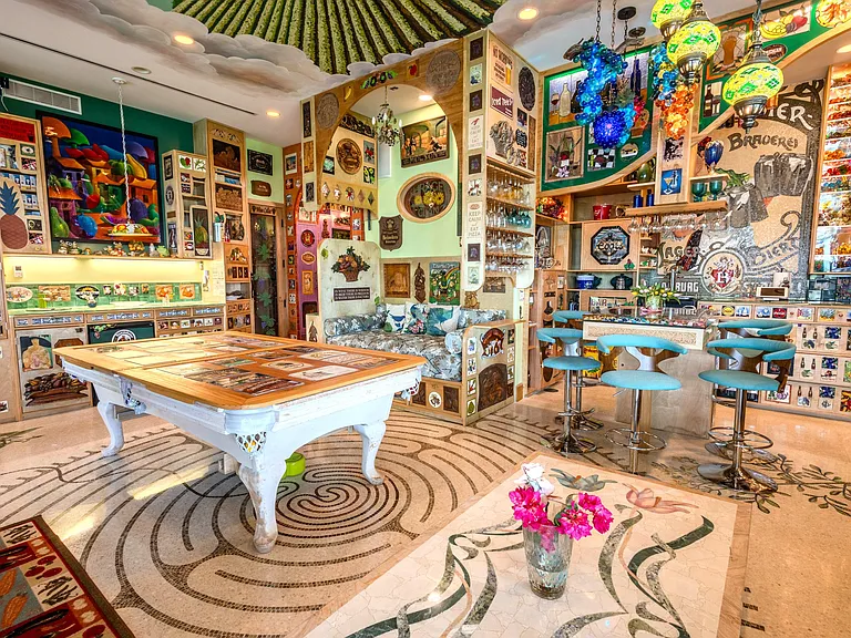 Crazy Florida mansion located at 1201 Marble Way in Boca Raton, la cornue kitchen with eclectic decor