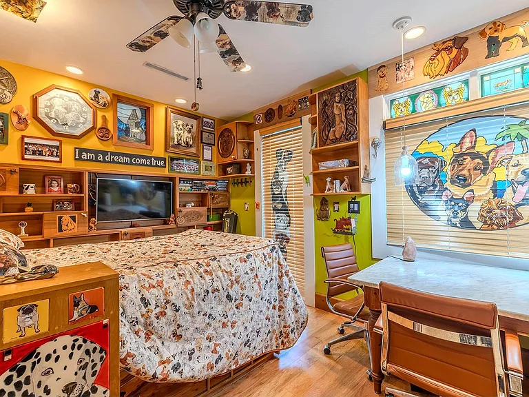 Crazy Florida mansion located at 1201 Marble Way in Boca Raton, eclectic wood and floral bedroom