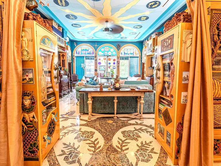 Crazy Florida mansion located at 1201 Marble Way in Boca Raton, eclectic turquoise living room