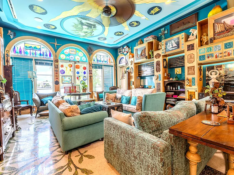 Crazy Florida mansion located at 1201 Marble Way in Boca Raton, eclectic turquoise living room