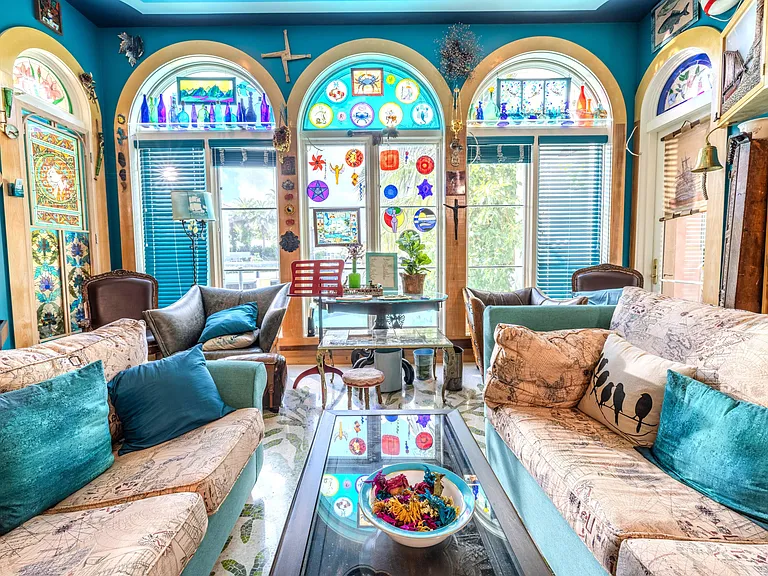 Crazy Florida mansion located at 1201 Marble Way in Boca Raton, eclectic turquoise living room