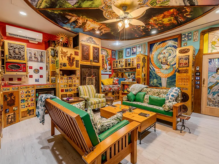 Crazy Florida mansion located at 1201 Marble Way in Boca Raton, interior eclectic den and living room with ceiling mosaic and art