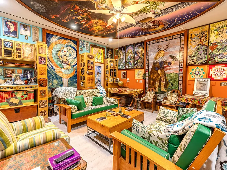 Crazy Florida mansion located at 1201 Marble Way in Boca Raton, interior eclectic den and living room with ceiling mosaic and art