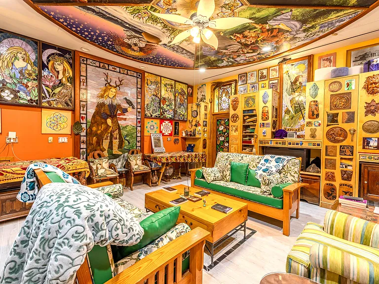 Crazy Florida mansion located at 1201 Marble Way in Boca Raton, interior eclectic den and living room with ceiling mosaic and art