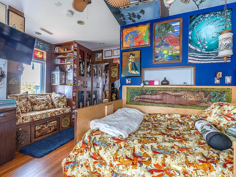 Crazy Florida mansion located at 1201 Marble Way in Boca Raton, interior blue themed bedroom with eclectic decor