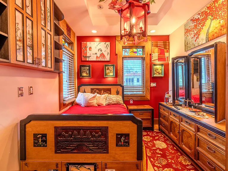 Crazy Florida mansion located at 1201 Marble Way in Boca Raton, interior red themed bedroom with eclectic decor