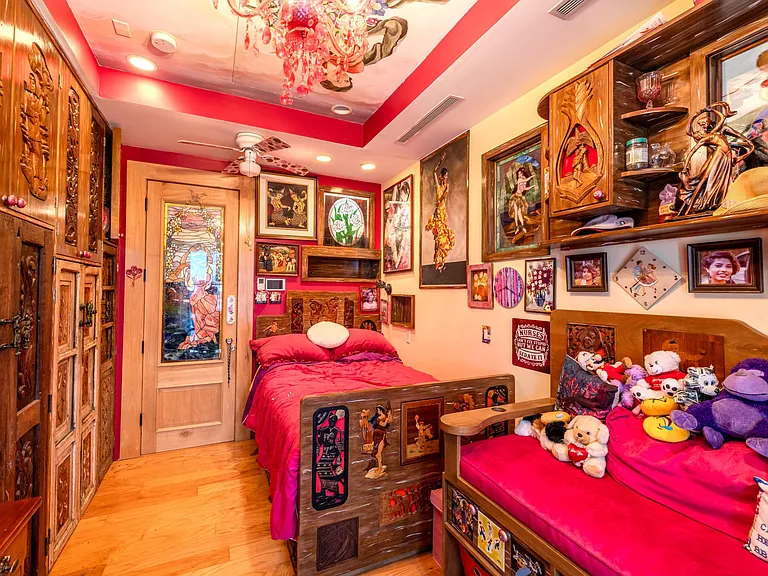 Crazy Florida mansion located at 1201 Marble Way in Boca Raton, interior red themed bedroom with eclectic decor