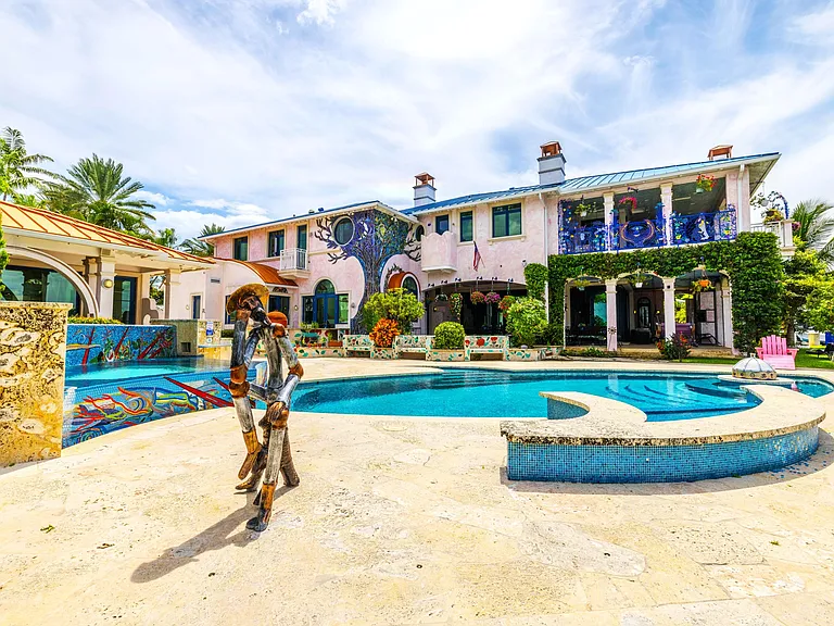 Crazy Florida mansion located at 1201 Marble Way in Boca Raton, exterior tile mosaic walls against stucco siding