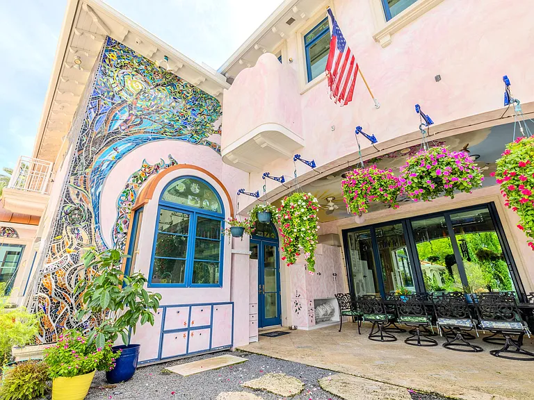 Crazy Florida mansion located at 1201 Marble Way in Boca Raton, exterior tile mosaic walls against stucco siding