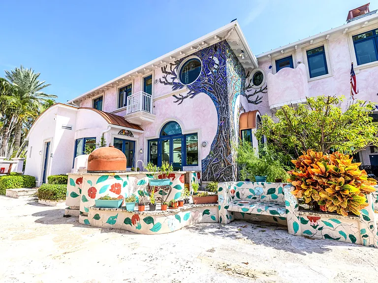 Crazy Florida mansion located at 1201 Marble Way in Boca Raton, exterior tile mosaic walls against stucco siding