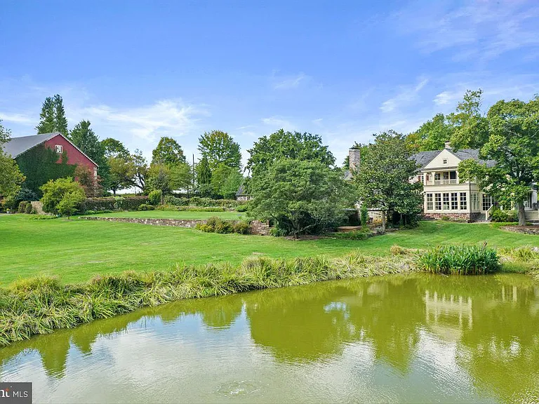 1700s equestrian estate in Lower Gwynedd Pennsylvania, colonial home exterior with stones and large pond