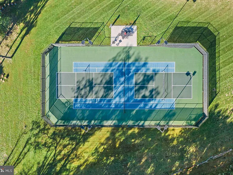 1700s equestrian estate in Lower Gwynedd Pennsylvania, private tennis court aerial view