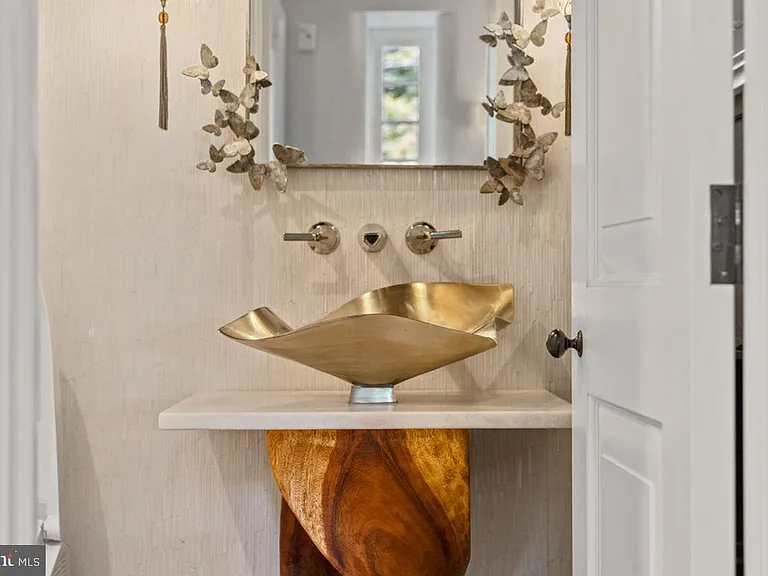 1700s equestrian estate in Lower Gwynedd Pennsylvania, colonial era    bathroom with modern gold sink and fixtures