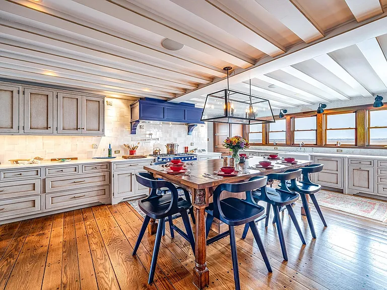 Timeless NJ bayfront beach house, rustic interior kitchen with seaviews of 612 S Bayview Drive in Strathmere, New Jersey with exposed wood beams