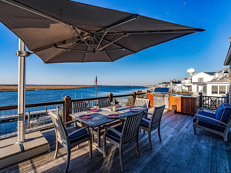 Timeless NJ bayfront beach house, rustic interior kitchen with seaviews of 612 S Bayview Drive in Strathmere, New Jersey with exposed wood beams