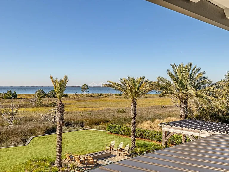 Most beautiful mansion on Saint Simons Island, Georgia, exterior and wood boarkwalk through nature