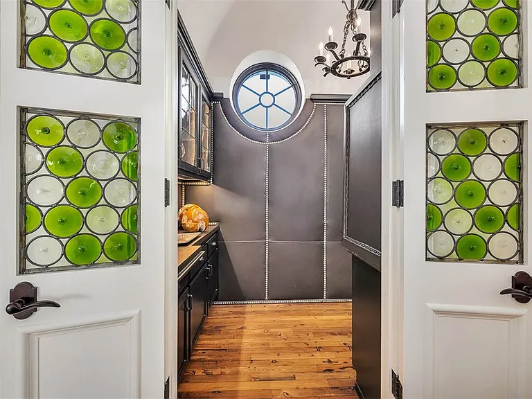 Most beautiful mansion on Saint Simons Island, Georgia, green and white glass wine bottle doors