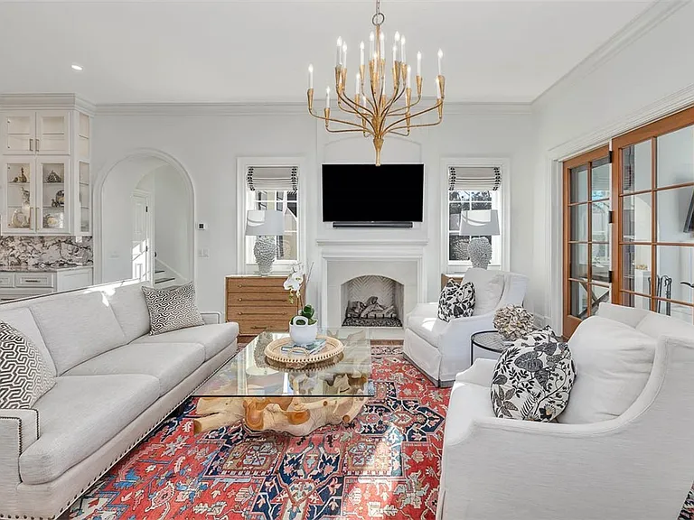 Most beautiful mansion on Saint Simons Island, Georgia, white red and gold living room with natural wood finishes